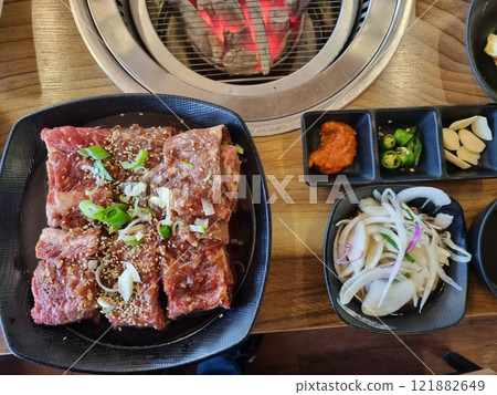 Korean BBQ. Seasoned beef ribs Korean BBQ. Seasoned beef ribs 121882649