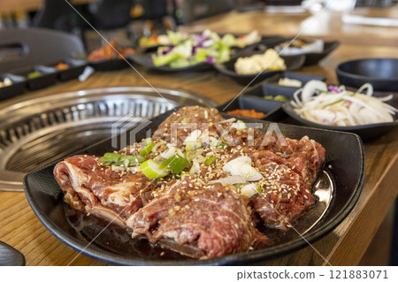 Korean BBQ. Seasoned beef ribs Korean BBQ. Seasoned beef ribs 121883071