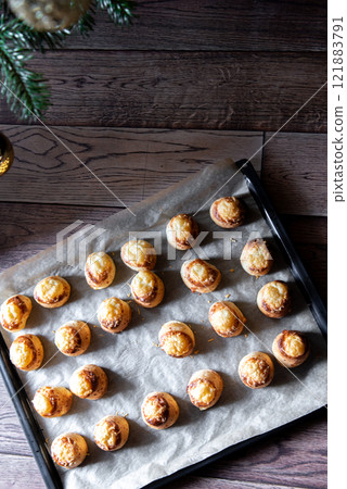 Pogaca stuffed with cheese. A full tray of fresh Pogaca, salty buns with cheese - Pogace. Pogaca stuffed with cheese. A full tray of fresh Pogaca, salty buns with cheese - Pogace. 121883791