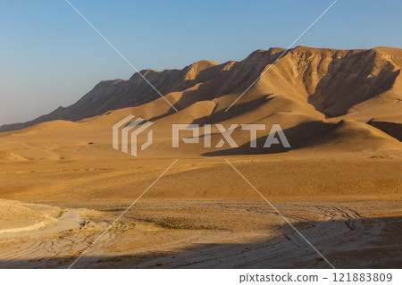 Breathtaking landscape of Kunduz Province showcasing rugged mountains under a clear sky 121883809