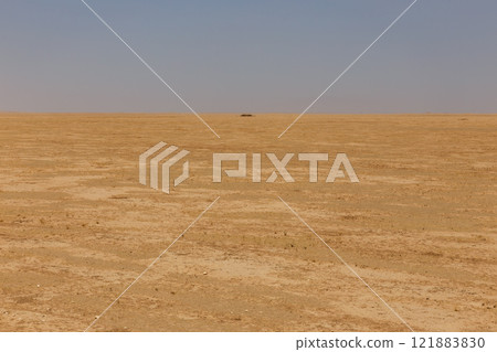 Vast arid landscape in Kunduz Province Afghanistan showcasing dry terrain and distant horizon Vast arid landscape in Kunduz Province Afghanistan showcasing dry terrain and distant horizon 121883830