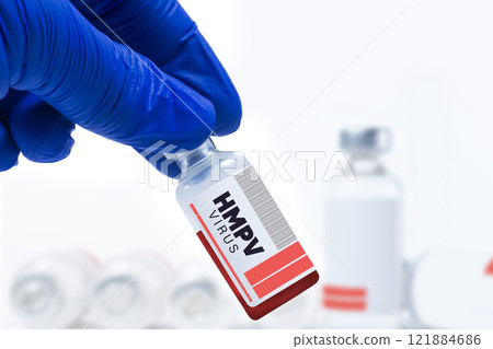 Medical researcher holds HMPV vaccine vial in laboratory setting 121884686
