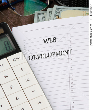 Concept word WEB DEVELOPMENT it is written in a notebook on a blank page, a vertical photo Concept word WEB DEVELOPMENT it is written in a notebook on a blank page, a vertical photo 121884886