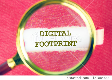A magnifying glass focuses on the phrase digital footprint, illustrating its significance in technology and business environments today A magnifying glass focuses on the phrase digital footprint, illustrating its significance in technology and business environments today 121884888