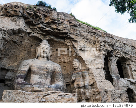 Stunning giant Buddha in Yungang grottoes, ancient buddhist temple in Datong, Shanxi province, China Stunning giant Buddha in Yungang grottoes, ancient buddhist temple in Datong, Shanxi province, China 121884979