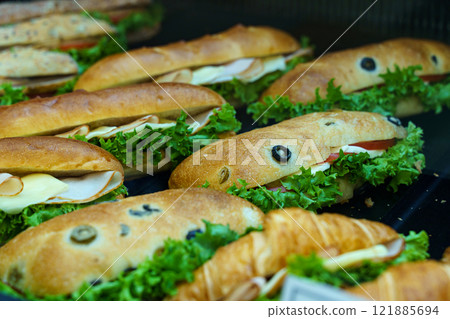 Delicious sandwiches arranged beautifully on a decorative platter Delicious sandwiches arranged beautifully on a decorative platter 121885694