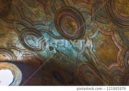 Explore the vibrant ceiling art with intricate circular patterns and captivating textures. Ancient ruins of Pompei city, Naples, Italy. 121885876