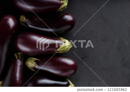 Fresh Farm-to-Table Eggplants on Dark Surface for Rural Economy and Organic Farming, Top View, Copy Space 121885962