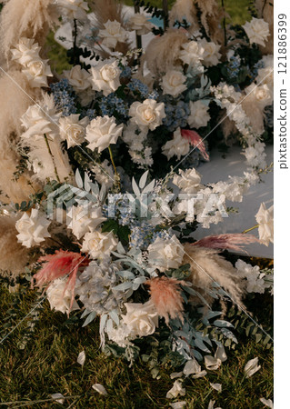 A beautiful bunch of colorful flowers is laying on the ground 121886399