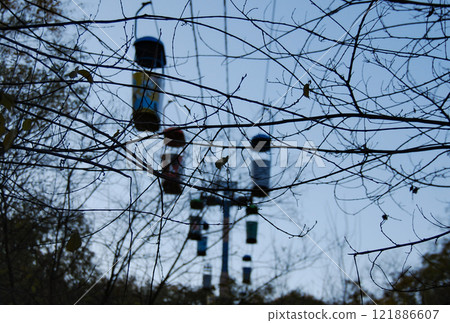 Odessa cable car. Against the backdrop of a blue sky are the cabins of the cable car that connects the French Boulevard with Otrada Beach. Odessa cable car. Against the backdrop of a blue sky are the cabins of the cable car that connects the French Boulevard with Otrada Beach. 121886607