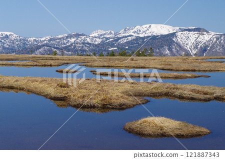 Early spring in Oze, Ayamedaira pond and snow-covered Mt. Hiragatake 121887343