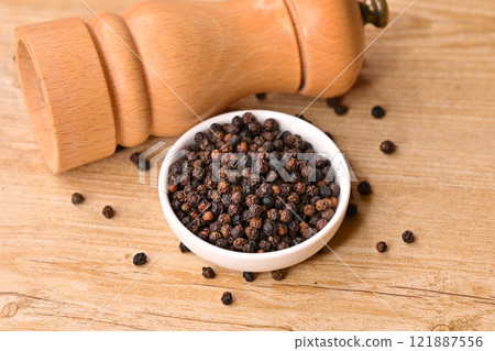Black pepper, black peppercorns, black pepper, spices, seasonings, whole spices, pepper mill. Black pepper, black peppercorns, black pepper, spices, seasonings, whole spices, pepper mill. 121887556