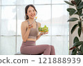 Fitness loving young asian woman sitting eating salad, health concept, exercise, healthy eating 121888939