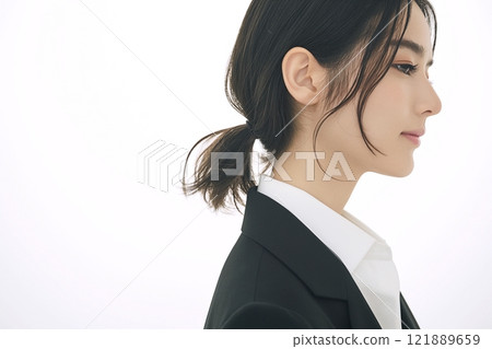 Profile of a woman in a suit "AI generated image" 121889659