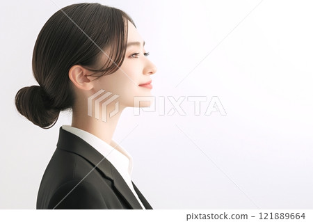 Profile of a woman in a suit "AI generated image" 121889664