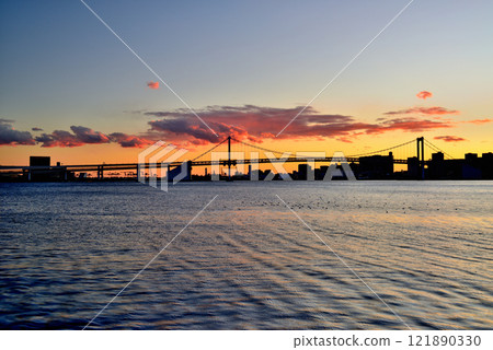 Evening view of Rainbow Bridge and Odaiba Seaside Park from Harumi Pier Park 121890330