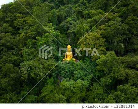 Large golden Buddha statue surrounded by lush greenery in Saraburi, Thailand on October 7, 2023 Large golden Buddha statue surrounded by lush greenery in Saraburi, Thailand on October 7, 2023 121891314