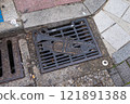 Drain cover on Dobuita Street, Yokosuka 121891388