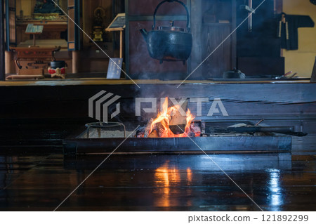 Burning firewood 121892299