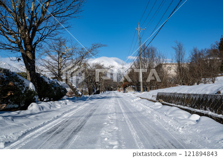 A clear morning, snow still remaining on the road in Hakuba Village, Nagano Prefecture A clear morning, snow still remaining on the road in Hakuba Village, Nagano Prefecture 121894843