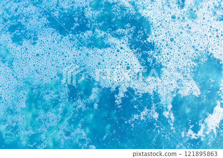 Many bubbles floating on the blue water surface 121895863