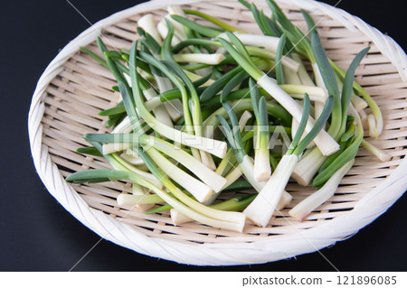 Chives in a colander 121896085