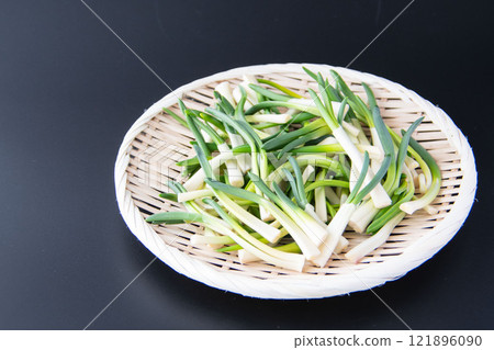 Chives in a colander Chives in a colander 121896090