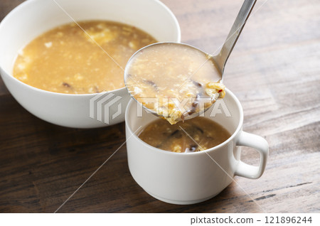 Serve hot and sour soup Serve hot and sour soup 121896244