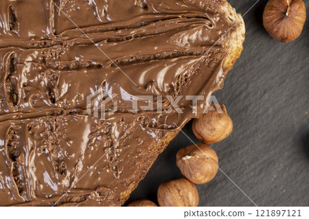hazelnuts and bread with nut paste with chocolate 121897121