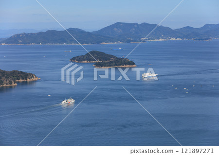 Jumbo Ferry and the international ferry, Kokusai Maru No. 11, meeting in Bisan Seto off the coast of Takamatsu in the Seto Inland Sea (Shodoshima is in the background) 121897271