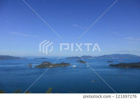 Jumbo Ferry and the international ferry 11th Kokusai Maru meet in the Bisan Seto Strait off the coast of Takamatsu, Seto Inland Sea. 121897276