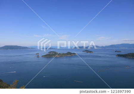 Seto Inland Sea, the islands of Bisan Seto off the coast of Takamatsu (Oshima in the foreground, Aji Peninsula on the right, Teshima, Koteshima, and Shodoshima in the background from left) Seto Inland Sea, the islands of Bisan Seto off the coast of Takamatsu (Oshima in the foreground, Aji Peninsula on the right, Teshima, Koteshima, and Shodoshima in the background from left) 121897390