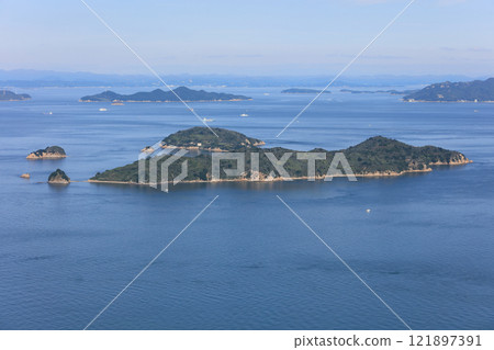 Oshima Island in the Bisan Seto Strait off the coast of Takamatsu. Behind it on the left is Ko-Teshima Island, and on the right is Shodoshima Island. 121897391
