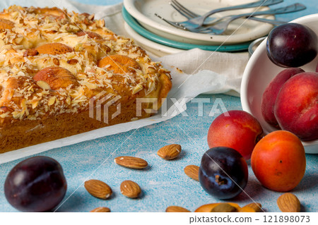 Cottage cheese pie with apricot and plum 121898073