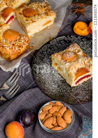 Cottage cheese pie with apricot and plum 121898074