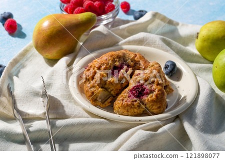 Pear and raspberry scones. Fresh pastries 121898077