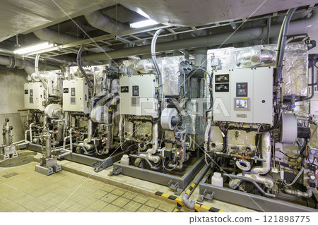 Absorption hot and cold water machine installed in the basement. Photo courtesy of Denpa Gakuen, Tokyo Electronics College. Absorption hot and cold water machine installed in the basement. Photo courtesy of Denpa Gakuen, Tokyo Electronics College. 121898775