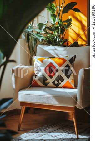 Bright and cozy corner with a chair 121899186