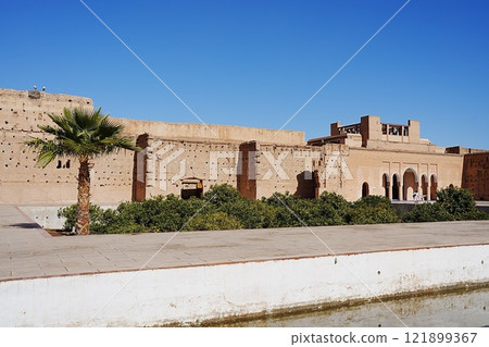 View of El Badi palace reflected in water in Marrakech city in Morocco View of El Badi palace reflected in water in Marrakech city in Morocco 121899367