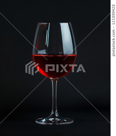 Elegant red wine glass on display 121899428