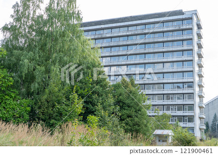 Abandoned sanatorium. Conserved multi-storey building with windows and balconies. Modernism in architecture of the 1960s. Ukraine, Truskavets resort. 121900461