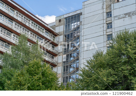 Abandoned sanatorium. Conserved multi-storey building with windows and balconies. Modernism in architecture of the 1960s. Ukraine, Truskavets resort. Abandoned sanatorium. Conserved multi-storey building with windows and balconies. Modernism in architecture of the 1960s. Ukraine, Truskavets resort. 121900462