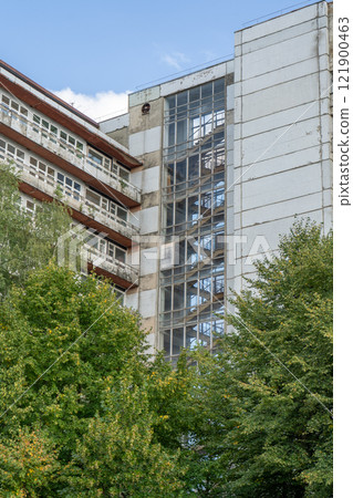Abandoned sanatorium. Conserved multi-storey building with windows and balconies. Modernism in architecture of the 1960s. Ukraine, Truskavets resort. 121900463