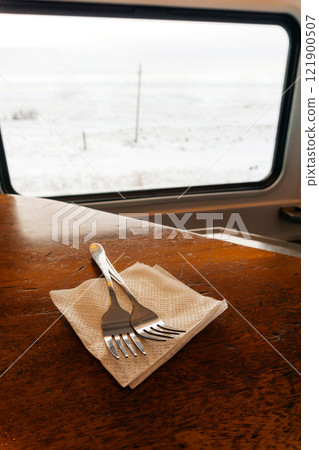 lunch items in the dining train. spoon and fork in the cafe of the railway train lunch items in the dining train. spoon and fork in the cafe of the railway train 121900507