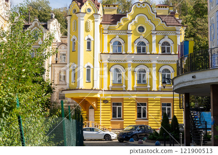Yellow home. Facade house. Residential buildings. Bright windows. Balcony modern architecture street Yellow home. Facade house. Residential buildings. Bright windows. Balcony modern architecture street 121900513