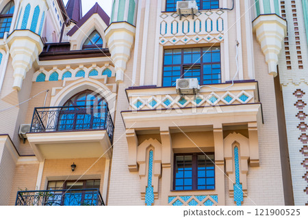 Facade of colorful house. Residential buildings. Bright windows. Balcony modern architecture. 121900525