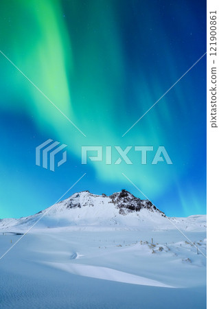 Aurora Borealis. Northern lights. Nature. Scandinavian countries. Snow and ice on the mountains. Aurora Borealis. Northern lights. Nature. Scandinavian countries. Snow and ice on the mountains. 121900861