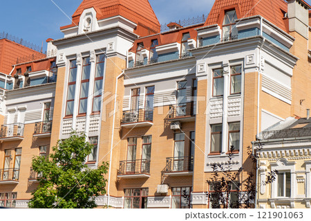 Orange color modern exterior of Houses Buildings. Bright windows Orange color modern exterior of Houses Buildings. Bright windows 121901063