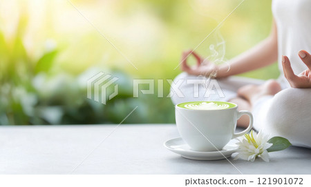serene moment with steaming cup of matcha latte and meditation in natural setting 121901072