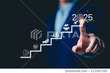 2025 New Year Business Goals Concept. Businessmen point to "2025" on a staircase, steps toward achieving business goals, growth, and success in the new year. Planning and challenge, investors target, 2025 New Year Business Goals Concept. Businessmen point to "2025" on a staircase, steps toward achieving business goals, growth, and success in the new year. Planning and challenge, investors target, 121901385